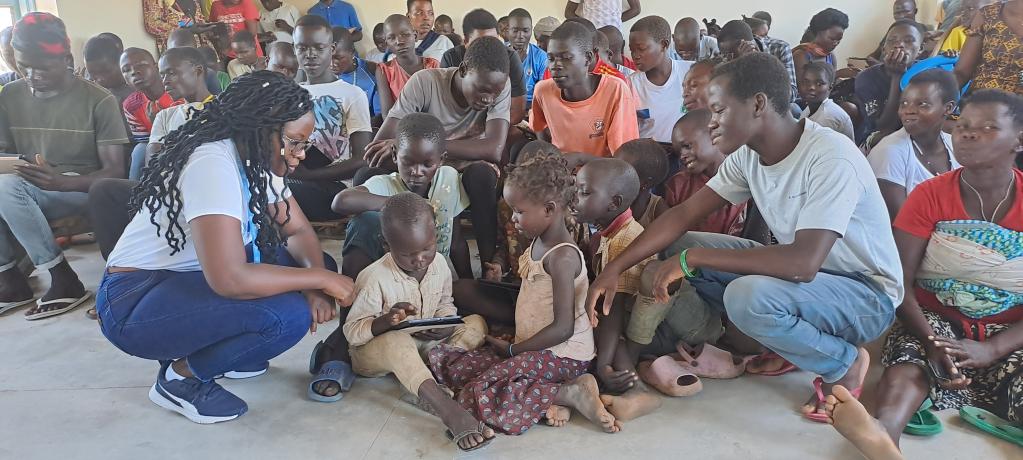 children during a digital literacy class in Imvepi Refugee Settlement