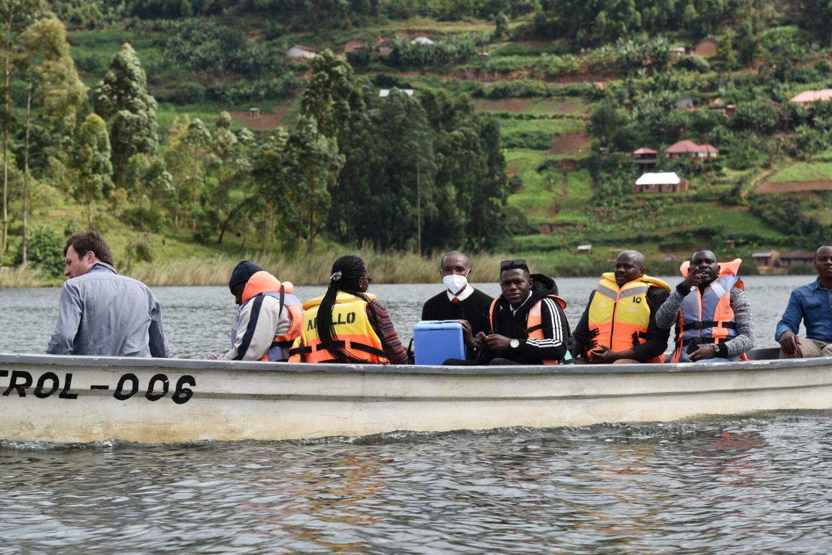 Medical personnel crossing Lake Bunyonyi with vaccines for Butanda Health Centre