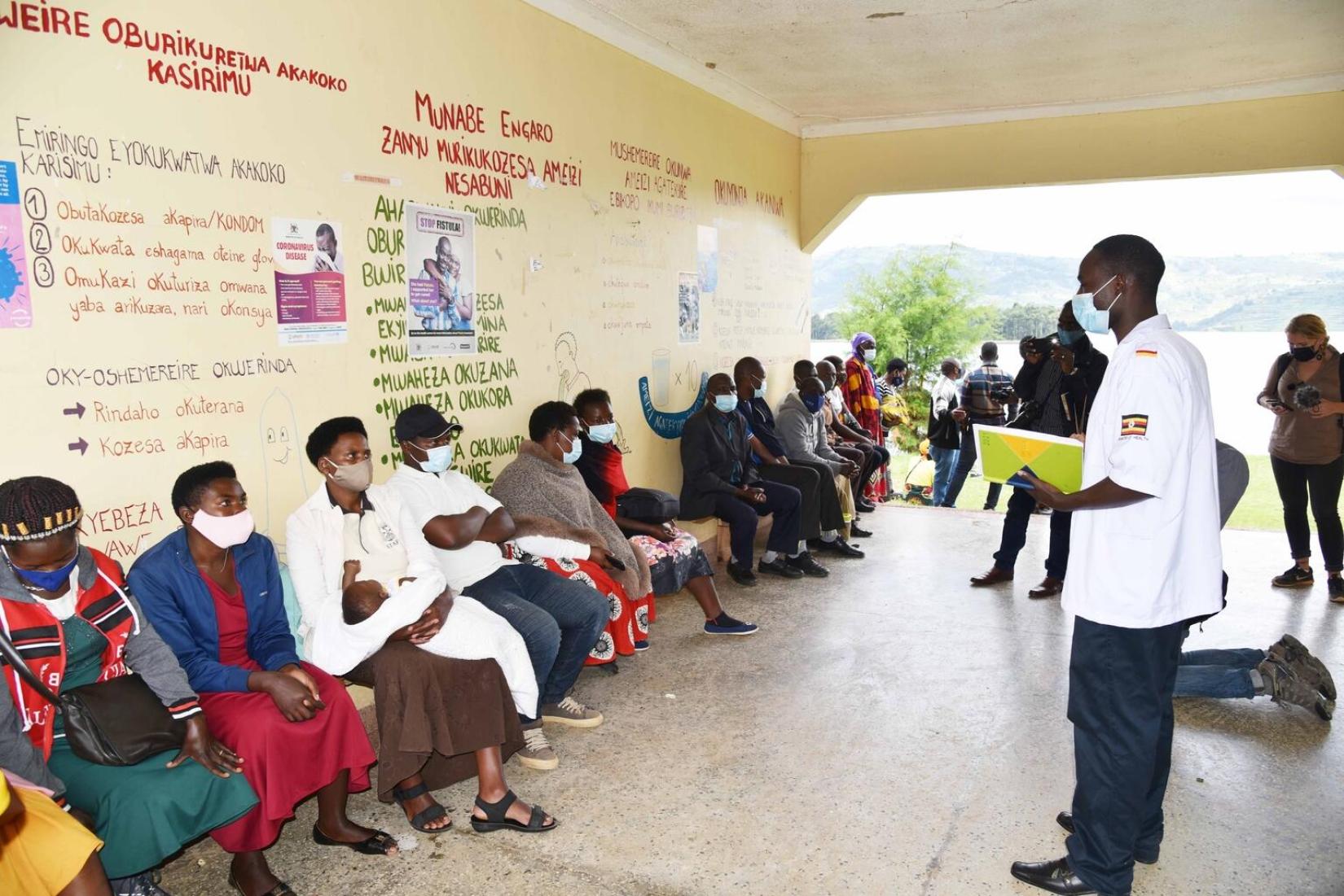 A doctor addressing patients at Butanda Health Centre