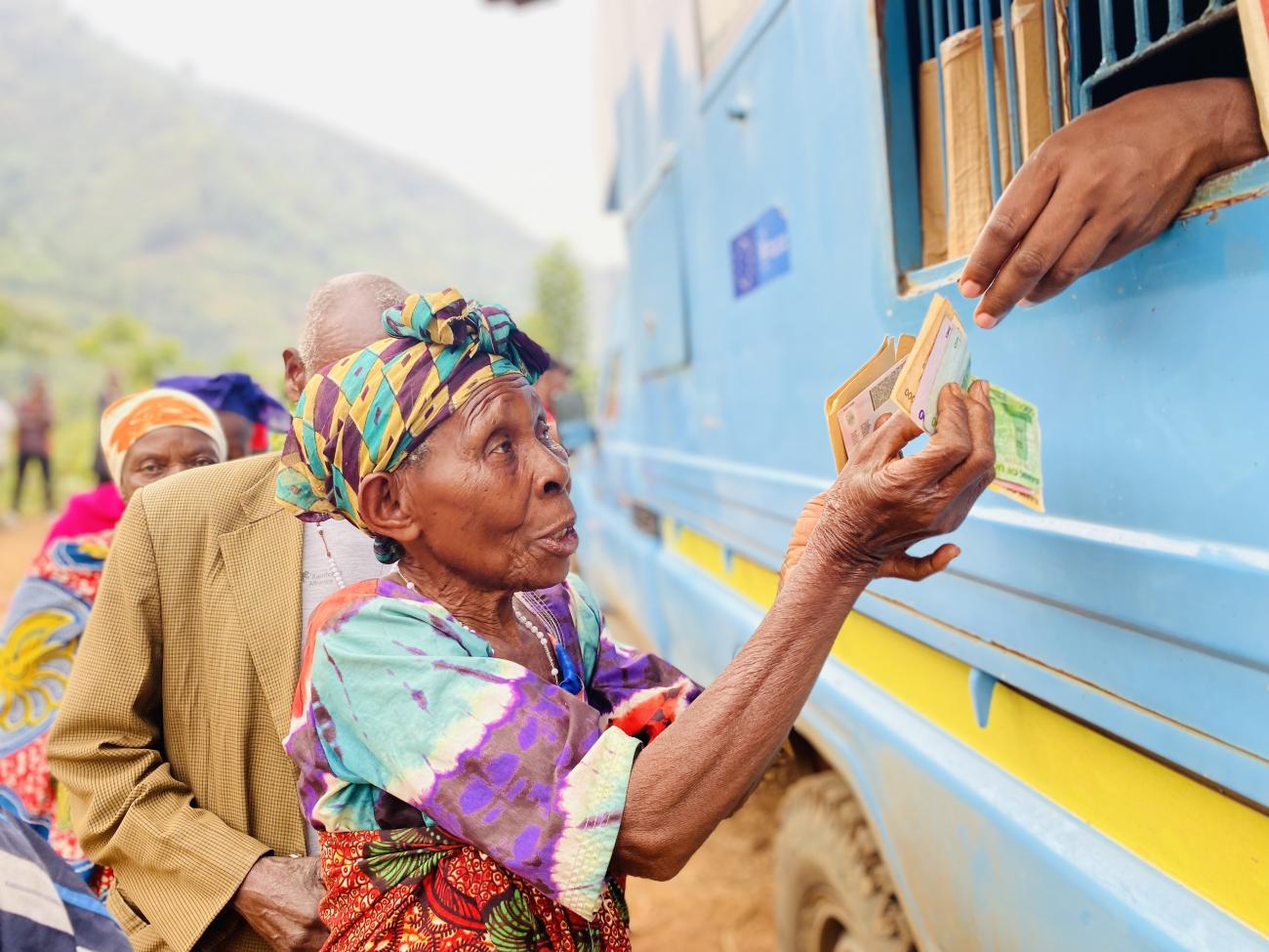 Racheal Mbambu receives cash assistance to help her start a new life