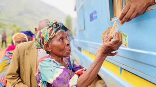 Racheal Mbambu receives cash assistance to help her start a new life