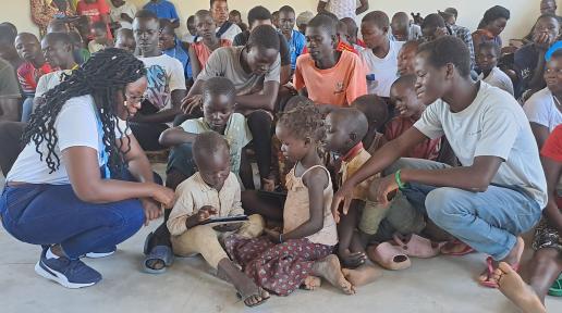 children during a digital literacy class in Imvepi Refugee Settlement